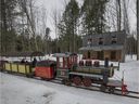 A train takes visitors around the property and in front of an old western building at Le Chalet des Érables in Ste-Anne-des-Plaines, north of Montreal. 
