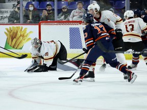 Vancouver Giants netminder Jesper Vikman covers up the puck Friday with Kamloops Blazers lurking.