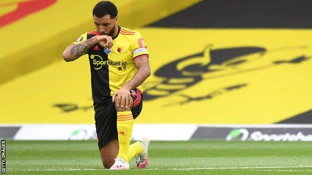 Troy Deeney taking the knee before a Watford game in 2020