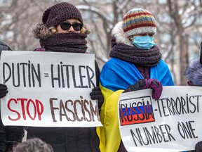 People rally at Place du Canada in Montreal on Sunday, Feb. 27, 2022 to decry the Russian invasion of Ukraine.
