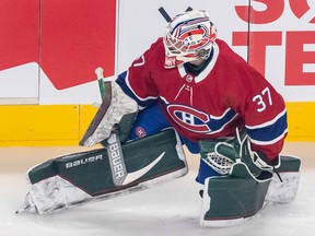 Canadiens goaltender Andrew Hammond stretches during warmup prior to the game against the St. Louis Blues in Montreal on Thursday, Feb. 17, 2022.