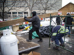 Some protesters were seen moving supplies out of Confederation Park on Sunday.