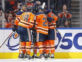 The Edmonton Oilers celebrate a goal by forward Tyler Benson, his first in the NHL, against the Minnesota Wild at Rogers Place on Feb. 20.