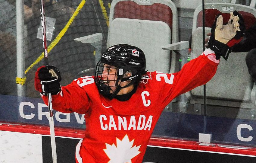 Marie-Philip Poulin looks to the referee for confirmation that her overtime shot went in Tuesday night.  Game continued as the shot was reviewed and was quickly determined to be a goal, giving Canada a 3-2 victory over the United States and the gold medal at the Women’s World Championships.