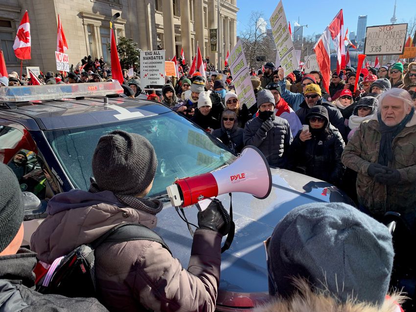 Protesters against COVID-19 mandates and supporting the Ottawa trucker convoy line the streets of downtown Toronto on February 5, 2022 near Queen's Park.
