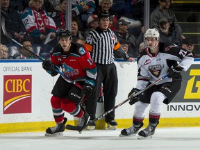 Vancouver Giants defenseman Connor Horning (right) keeps then-Kelowna Rocket Ethan Ernst in check during a December 2019 Western Hockey League game at Kelowna's Prospera Place.