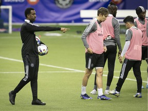 CF Montréal head coach Wilfried Nancy, left, instructs players during practice at Olympic Stadium on Thursday, March 3, 2022.