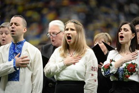 Members of the Ukranian choir sing their National Anthem before the start of the first half at BC Place.  Photo: Anne-Marie Sorvin-USA TODAY Sports