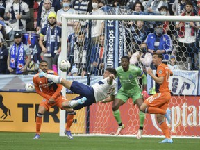 Vancouver Whitecaps forward Lucas Cavallini shoots the ball against New York City FC goalkeeper Sean Johnson during the first half at BC Place.  Photo: Anne-Marie Sorvin-USA TODAY Sports