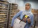 Surria Fadel, co-owner of Cedar Valley Selections, is pictured with one of her products, authentic style pita chips, at her plant in Oldcastle, on Friday, June 25, 2021.