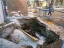 Water gushes from a water main on Laurier Blvd. at the corner of St-Laurent Blvd. in March 3, 2015. 