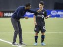 CF Montréal's head coach Wilfried Nancy talks with player Joaquin Torres during second half MLS soccer action against the Philadelphia Union in Montreal on Saturday, March 5, 2022.