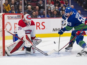 Montreal Canadiens goalie Sam Montembeault (35) makes a save on Vancouver Canucks forward Bo Horvat (53) in the first period at Rogers Arena.
