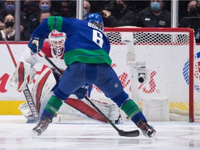 Montreal Canadiens goalie Sam Montembeault, back, stops Vancouver Canucks' Brock Boeser during the second period of an NHL hockey game in Vancouver, on Wednesday, March 9, 2022.