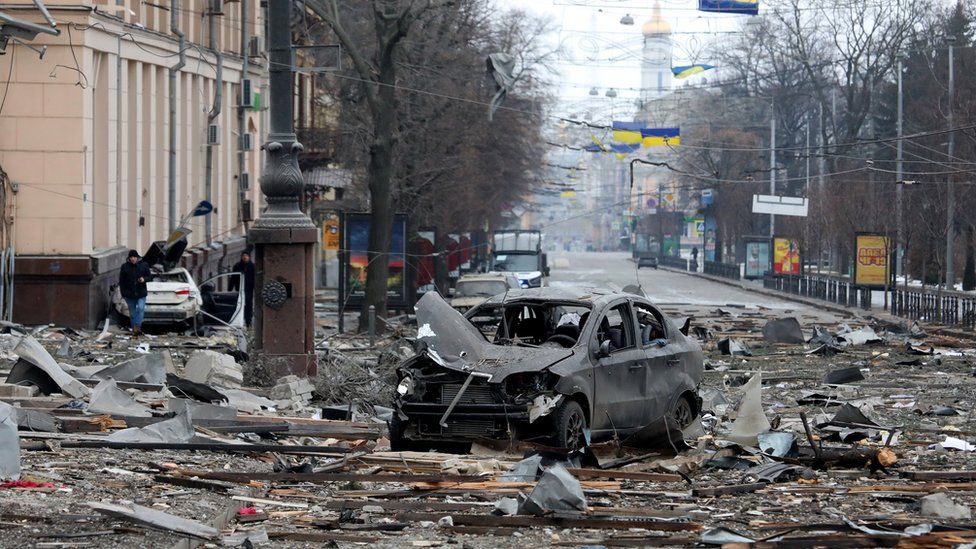 A burnt-out car is seen on the street after a missile launched by Russian invaders hit near the Kharkiv Regional State Administration building in Svobody (Freedom) Square) at approximately 8 am local time on Tuesday, March 1, Kharkiv