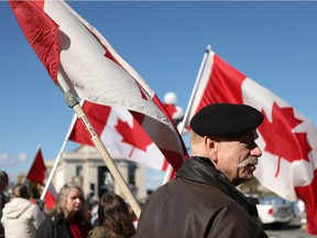 Hundreds of convoy supporters gathered at the BC Legislature to protest COVID-19 mandates in the province while in Victoria, BC, on Saturday, March 5, 2022.