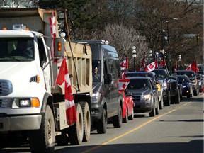 Hundreds of convoy supporters gathered at the BC Legislature to protest COVID-19 mandates in the province while in Victoria, BC, on Saturday, March 5, 2022.