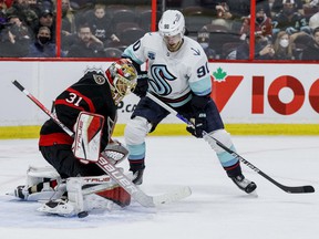 Ottawa Senators goaltender Anton Forsberg (31) stops Seattle Kraken left wing Marcus Johansson (90) during second period NHL action at the Canadian Tire Center on March 10, 2022.