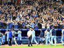 Blue Jays fans applaud their team off the field after a season ending victory over the Orioles at Rogers Center in Toronto, Sunday, Oct. 3, 2021.