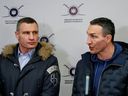 Brothers Wladimir (left) and Vitali Klitschko, both former world heavyweight champions, talk to journalists early this month in Kyiv, at a Ukrainian Territorial Defense Forces recruitment centre, three weeks before the Russian bombs started dropping on Ukraine.