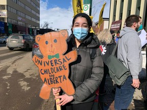 Monica Bassili, an organizer with Climate Justice Edmonton, takes part in a rally on Saturday, March 12, 2022, outside Liberal MP Randy Boissonnault's office in Edmonton calling for the federal government to implement the Just Transition Act.