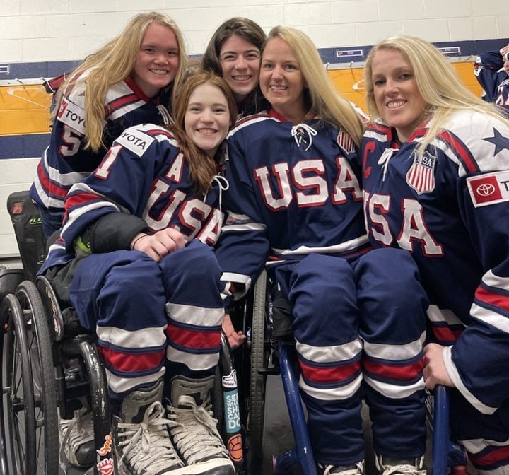 Members of the U.S. women's development sled hockey team at a camp in January 2022. From left to right: Maddy Eberhard, Kelsey DiClaudio, Katie Ladlie, Monica Quimby, and Erica McKee (nee Mitchell).