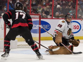 Chicago Blackhawks goalie Marc-Andre Fleury (29) makes a save in front of Ottawa Senators center Adam Gaudette (17) in the second period at the Canadian Tire Center.