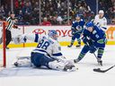 Tampa Bay Lightning goalie Andrei Vasilevskiy (88) makes a save on Vancouver Canucks forward Matthew Highmore (15) in the first period at Rogers Arena.