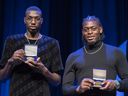 NBA players Chris Boucher, left, and Luguentz Dort pose with their medals from the Quebec National Assembly during a ceremony in Montreal on Aug. 27, 2021.