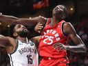 Raptors forward Chris Boucher, right, blocks Brooklyn Nets forward Alan Williams during NBA pre-season game in 2018. The Bell Center crows gave Boucher, a Montreal native, a standing ovation when he entered the game.
