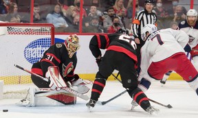 Ottawa Senators goalie Anton Forsberg makes a save in front of Columbus Blue Jackets center Sean Kurali (7) in the first period at the Canadian Tire Center.