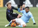 CF Montréal midfielder Matko Miljevic (11) commits a foul against New York City midfielder Maximiliano Moralez (10) and gets a yellow card in the first half of a MLS game at Yankee Stadium on Saturday, March 12, 2022, in New York.