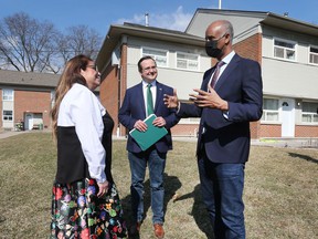 Caldwell First Nation Chief Mary Duckworth, left, MP Irek Kusmierczyk and Federal Minister of Housing and Diversity and Inclusion Ahmed Hussen chat at a press conference in Windsor on Thursday, March 17, 2022 regarding new housing in the city.