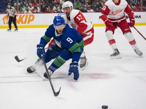 Detroit Red Wings defenseman Filip Hronek (chases Vancouver Canucks forward JT Miller in the first period at Rogers Arena March 17.