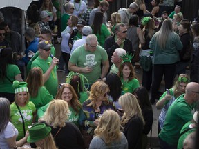 A full house of revelers celebrate St. Patrick's Day at the Old Victoria Tavern in Olde Walkerville, on Thursday, March 17, 2022.