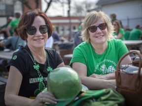 Beth Hilton and Sandi Sole enjoy the warm weather while attending St. Patrick's Day festivities at the new WindsorEats location on Erie Street East, Thursday, March 17, 2022.