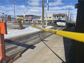 Police tape cordons off 118 Avenue near 125 Street in Edmonton on Saturday, March 12, 2022, after what appears to be a major shooting event in the area.