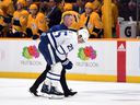 Toronto Maple Leafs right wing Ondrej Kase is assisted off the ice after suffering an apparent injury during the second period against the Nashville Predators at Bridgestone Arena in Nashville, Tenn., March 19, 2022.