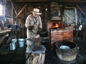 A blacksmith displays his skills at the maple syrup celebration at the John R. Park Homestead on Saturday, March 19, 2022.