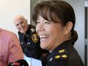 Deputy Chief Pam Mizuno was named Acting Chief following Thursday's Windsor Police Services Board meeting at City Hall.  Behind, outgoing Chief Al Frederick smiles following the announcement.