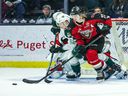 Vancouver Giants defenseman Connor Horning battles for position with Everett Silvertips forward Michal Gut in Everett's 5-2 win at home on Saturday.
