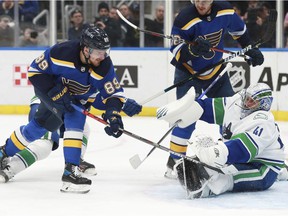 St. Louis Blues' Pavel Buchnevich (89) shoots the puck against Vancouver Canucks' Jaroslav Halak (41) during the second period of an NHL hockey game Monday, March 28, 2022 in St. Louis.