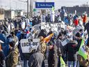 Members of the Syndicat des travailleuses et travailleurs de Rolls-Royce Canada picket outside the plant in the Lachine borough of Montreal Wednesday, March 16, 2022 one day after being locked out by company management.  The union's last collective agreement with the company expired in March 2020.
