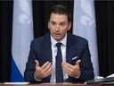 Quebec Justice Minister Simon Jolin-Barrette, left, explains legislation that would create a special tribunal dealing with sexual crimes, Wednesday, September 15, 2021 at the legislature in Quebec City.