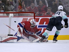 Seattle Kraken forward Marcus Johansson scores the winning shootout goal against Montreal Canadiens goalie Sam Montembeault at the Bell Center on March 12, 2022