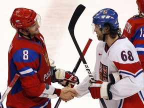 Alex Ovechkin (left) and Jaromir Jagr, greet each other in a post-game handshake at the 2010 Vancouver Winter Olympics, 'figured' into this week's news for different reasons: While Jagr's fundraiser for Ukrainian refugees raised significant money, Ovechkin's numerical pursuit of the NHL's career goal-scoring record was overshadowed by controversy over his long-standing support for Ukraine's chief invader, Russia President Vladimir Putin.