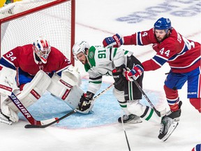 Canadiens defenseman Joel Edmundson received a cross-checking penalty after clearing Stars' Tyler Seguin from in front of Canadiens goaltender Jake Allen Thursday night at the Bell Centre.
