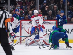 Montreal Canadiens' Jeff Petry (26) blocks Vancouver Canucks' JT Miller's shot on goal during the first period of an NHL hockey game in Vancouver, on Wednesday, March 9, 2022.