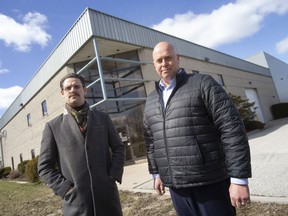 CRBE Windsor's Brad Collins, left, and Brook Handysides, are pictured outside a recently leased industrial property on North Talbot Road, on Monday, March 28, 2022.