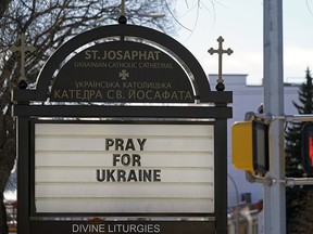 A sign of the times outside St. Josaphat's Ukrainian Catholic Cathedral in Edmonton on Thursday March 10, 2022.